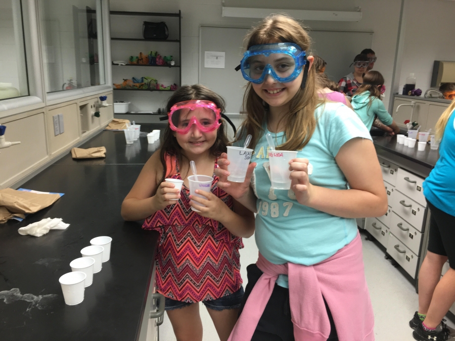 photo of two female students in goggles at science week